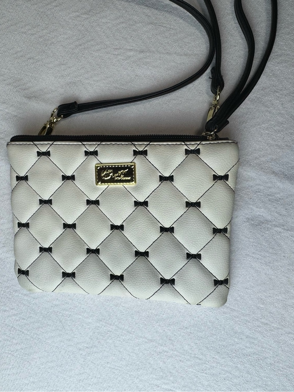 Betsey Johnson White Quilted Shoulder Crossbody with Black Trim Bows.